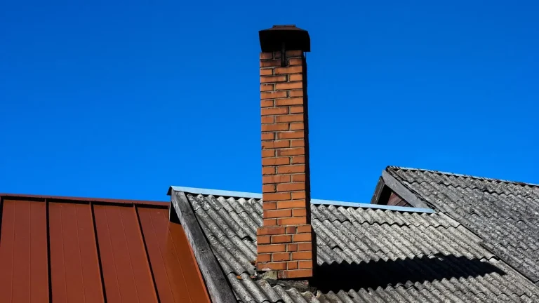 Standing seam metal roof next to a shingle roof, metal roofing in Duluth, MN